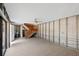 Unfinished basement featuring tile flooring, a staircase and a slider leading to the exterior at 712 1St Ct, Palm Harbor, FL 34684