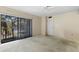 Bedroom featuring sliding glass doors to balcony. Blank canvas, ready for your design at 712 1St Ct, Palm Harbor, FL 34684