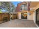 A private patio area with sliding glass doors providing a tranquil outdoor retreat and natural light at 712 1St Ct, Palm Harbor, FL 34684