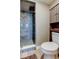 Well-appointed bathroom features a walk-in glass shower with custom tile surround and built-in storage at 7432 Sunshine Skyway S Ln # 206, St Petersburg, FL 33711