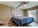 Bedroom with comfortable bedding and a ceiling fan at 7432 Sunshine Skyway S Ln # 206, St Petersburg, FL 33711