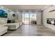 Living room with floor to ceiling windows leading to balcony at 7432 Sunshine Skyway S Ln # 206, St Petersburg, FL 33711