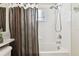 Shower-tub combo with shower curtain and tile surround at 7945 Carriage Pointe Dr, Gibsonton, FL 33534