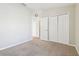 Bedroom with double door closet and neutral walls at 7945 Carriage Pointe Dr, Gibsonton, FL 33534