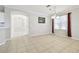 Cozy dining area featuring neutral decor, tile flooring, a modern light fixture, and a large window at 7945 Carriage Pointe Dr, Gibsonton, FL 33534