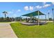 Community playground with green canopy at 7945 Carriage Pointe Dr, Gibsonton, FL 33534