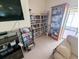 Cozy clubhouse area featuring a bookcase, TV, games, and a comfortable couch at 8445 Jeffrey N # 8445, Pinellas Park, FL 33781