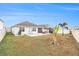 Wide backyard showcasing a patio, seating area, gazebo, grill, and spacious lawn, perfect for relaxation at 8990 Forge Breeze Loop, Wesley Chapel, FL 33545