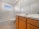 Full bathroom with wood vanity, white counter and combination tub and shower at 9003 Willowbrook Cir, Bradenton, FL 34212