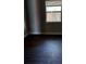 Bedroom featuring dark gray paint, a window and dark hard wood floors at 910 Seminole St, Clearwater, FL 33755