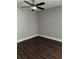 This bedroom features hard surface floors, neutral paint, and a ceiling fan at 910 Seminole St, Clearwater, FL 33755