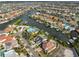 Expansive aerial view of waterfront homes, canals, and boats in a beautiful coastal community at 912 Symphony Beach Ln, Apollo Beach, FL 33572