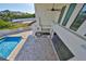 Aerial view of the pool area showcasing a built-in outdoor kitchen and spacious patio at 912 Symphony Beach Ln, Apollo Beach, FL 33572