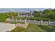 Fenced backyard features a well-manicured lawn and easy access to a private wooden pier at 912 Symphony Beach Ln, Apollo Beach, FL 33572