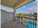 Outdoor balcony overlooking a community pool and waterway with neighborhood homes at 912 Symphony Beach Ln, Apollo Beach, FL 33572