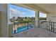 Balcony overlooking a canal and a community pool, perfect for outdoor living at 912 Symphony Beach Ln, Apollo Beach, FL 33572