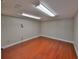 Finished basement with hardwood floors and recessed lighting at 912 Symphony Beach Ln, Apollo Beach, FL 33572