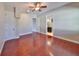 Bedroom featuring wood floors, a ceiling fan, and neutral-colored walls at 912 Symphony Beach Ln, Apollo Beach, FL 33572