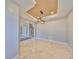 Bright dining room featuring marble floors, modern light fixture, and easy access to the staircase at 912 Symphony Beach Ln, Apollo Beach, FL 33572