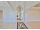 Grand foyer with marble floors, decorative inlays, soaring ceilings, and arched doorways at 912 Symphony Beach Ln, Apollo Beach, FL 33572