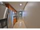 Well-equipped laundry room with modern washer, dryer, custom cabinets, and stainless refrigerator at 912 Symphony Beach Ln, Apollo Beach, FL 33572