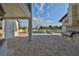 Expansive backyard featuring a sparkling pool and a built-in outdoor kitchen area at 912 Symphony Beach Ln, Apollo Beach, FL 33572