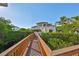 Enjoy the scenery from this private pier overlooking the waterfront home, lush shrubbery, and serene water views at 912 Symphony Beach Ln, Apollo Beach, FL 33572