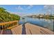 Enjoy waterfront living with this private dock, boat lift, and stunning views of the water and other homes at 912 Symphony Beach Ln, Apollo Beach, FL 33572