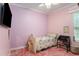 Bedroom with light pink walls, a small bed, and a window letting in natural light at 9321 Regatta Cir, Spring Hill, FL 34606