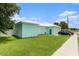 Exterior view of home with a lawn, and a driveway at 9321 Regatta Cir, Spring Hill, FL 34606