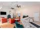 Expansive living room featuring high ceilings, dual ceiling fans and colorful furniture at 9321 Regatta Cir, Spring Hill, FL 34606