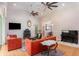 Open-concept living room featuring hardwood floors, multiple sofas, and a piano at 9321 Regatta Cir, Spring Hill, FL 34606