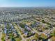 Aerial view of a residential neighborhood with neatly arranged homes and streets, close to the ocean at 5117 Cape Cod Dr, Holiday, FL 34690