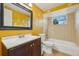 Bathroom featuring a vanity with dark wood cabinets and a shower-tub combo at 5117 Cape Cod Dr, Holiday, FL 34690