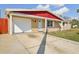 Charming single-story home featuring a front-facing garage and a well-maintained lawn at 5117 Cape Cod Dr, Holiday, FL 34690