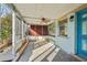 View of a cozy screened-in patio featuring a ceiling fan and an exterior door at 5117 Cape Cod Dr, Holiday, FL 34690