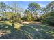 Large lot with mature trees offers plenty of space for outdoor activities and future development at 1011 Riverside Ridge Rd, Tarpon Springs, FL 34688