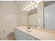 Bathroom with a single sink vanity and large mirror at 1011 Riverside Ridge Rd, Tarpon Springs, FL 34688