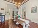 Open-concept dining room with seating for six and views into other living spaces at 1011 Riverside Ridge Rd, Tarpon Springs, FL 34688