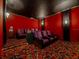 Private home theater features comfortable seating, custom lighting, and surround sound for immersive entertainment experiences at 1011 Riverside Ridge Rd, Tarpon Springs, FL 34688