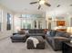 Spacious living room with modern furniture, large windows, and natural light at 1011 Riverside Ridge Rd, Tarpon Springs, FL 34688