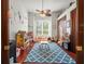 Bright and airy playroom featuring a ceiling fan, large window, hardwood floors and ample space for toys and activities at 1011 Riverside Ridge Rd, Tarpon Springs, FL 34688