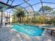 Screened pool and spa offer a private retreat with beautiful views of the surrounding landscape at 1011 Riverside Ridge Rd, Tarpon Springs, FL 34688