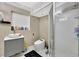 Modern bathroom with stylish vanity, a sleek toilet, and glass enclosed shower at 1011 W Columbus Dr, Tampa, FL 33602
