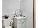 This bathroom features a white sink vanity, modern mirror, and a convenient toilet at 1011 W Columbus Dr, Tampa, FL 33602