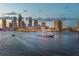 Scenic cityscape view at dusk with illuminated buildings and a boat on the water at 1011 W Columbus Dr, Tampa, FL 33602