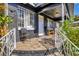 Charming front porch with chairs and railings, offering a cozy outdoor space at 1011 W Columbus Dr, Tampa, FL 33602