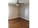 Standard bedroom with a ceiling fan and hardwood floors at 10200 Gandy N Blvd # 209, St Petersburg, FL 33702