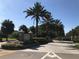 Inviting entrance with palm trees and landscaped signage to Vantage Point Condominiums at 10200 Gandy N Blvd # 209, St Petersburg, FL 33702