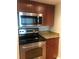 The kitchen features stainless steel appliances, granite counters, and modern lighting at 10200 Gandy N Blvd # 209, St Petersburg, FL 33702